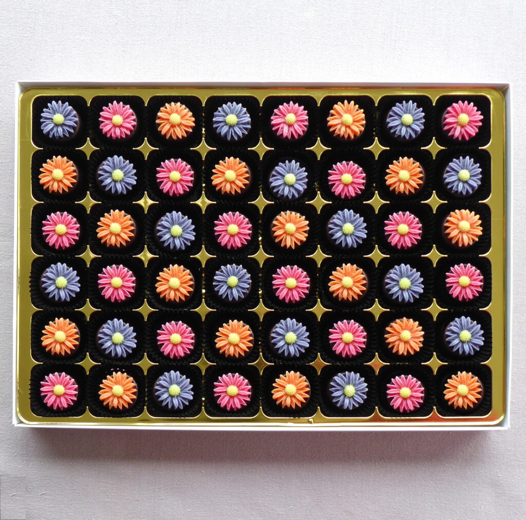 Marzipan daisies on chocolates